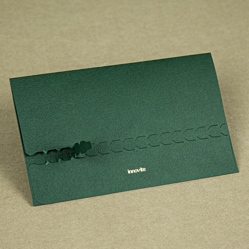 This deep green tear-off envelope weaves the ritual of letter-opening into its very paper grain.